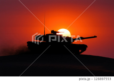 Powerful Silhouette of a Military Tank Against a Fiery Desert Sunset Powerful Silhouette of a Military Tank Against a Fiery Desert Sunset 128897553