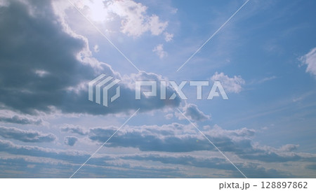 The Beautiful Cloudy Sky Illuminated by Sunlight Creates a Stunning Visual Experience 128897862