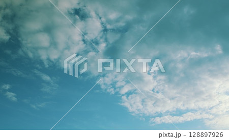 A Serene Sky with Fluffy Clouds The Perfect Choice for Beautiful Backgrounds to Use 128897926