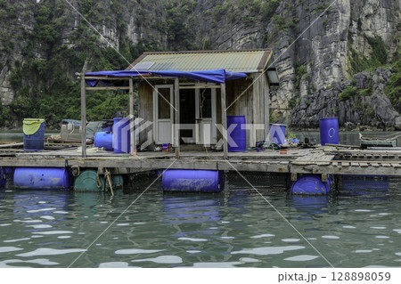 Vietnam, Floating houses, Vung Vieng fishing village, Ha Long Bay, Bai Tu Long area. Vietnam, Floating houses, Vung Vieng fishing village, Ha Long Bay, Bai Tu Long area. 128898059