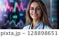 Smiling doctor with stethoscope analyzing medical charts and graphs in modern hospital 128898651
