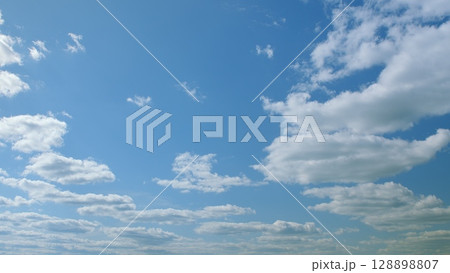 The Beautiful Sky with Soft Fluffy Clouds Displaying a Sense of Calmness and Serenity 128898807