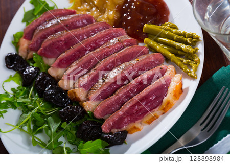 Duck breast Magret with prunes 128898984