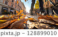 Man walking on cobblestone street covered with autumn leaves in rome 128899010
