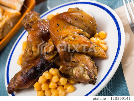 Tasty pork legs with chickpeas closeup Tasty pork legs with chickpeas closeup 128899141