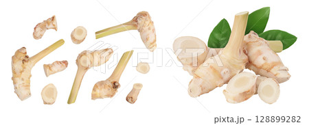 Fresh galangal root with slices isolated on white background with full depth of field. Top view. Flat lay Fresh galangal root with slices isolated on white background with full depth of field. Top view. Flat lay 128899282