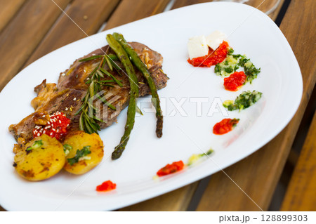 Photography of plate with baked veal with vegetables 128899303