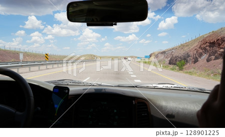 Driving along empty highway through american desert landscape 128901225