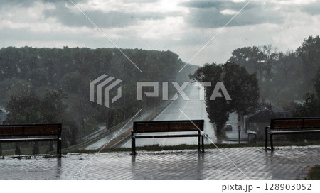 Benches Overlooking Rainy Roadscape 128903052