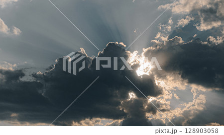 Sunbeams Breaking Through the Storm 128903058