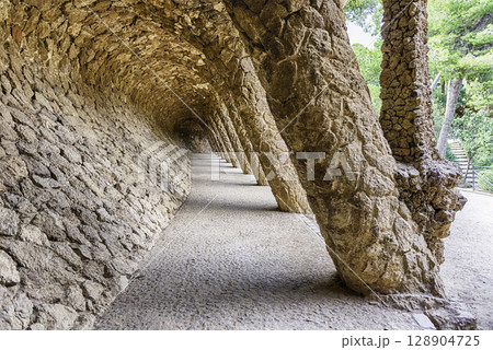 Colonnaded pathway in Park Guell, Barcelona, Catalonia, Spain 128904725