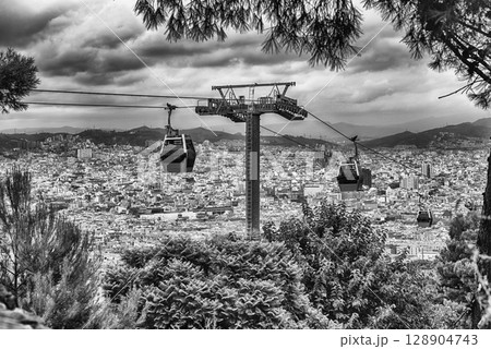 Montjuic Cable Cars and cityscape on background, Barcelona, Catalonia, Spain Montjuic Cable Cars and cityscape on background, Barcelona, Catalonia, Spain 128904743