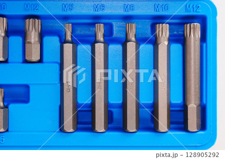 part of A set of single-sided chrome steel bits in a blue plastic box part of A set of single-sided chrome steel bits in a blue plastic box 128905292