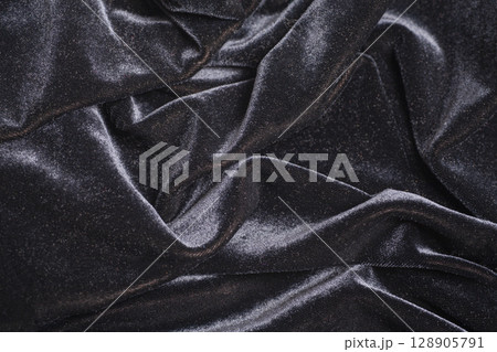 Black velvet fabric with folds Black velvet fabric with folds 128905791