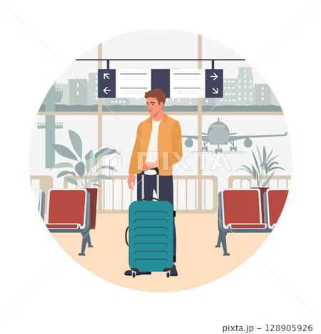 Airport traveler waiting with suitcase near boarding area, airplane visible through window 128905926