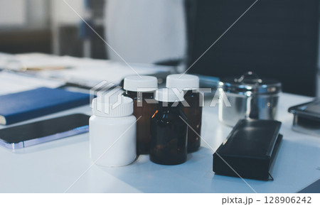 Young brunette woman having consultation at doctor office during Young brunette woman having consultation at doctor office during 128906242