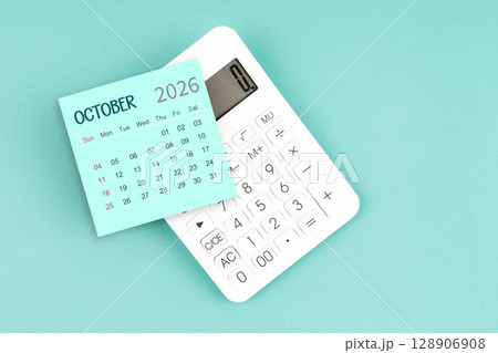 October 2026 calendar card with calculator on blue color background. 128906908