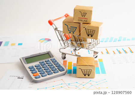 Online shopping, Shopping cart box on business graph, import export, finance commerce. 128907560