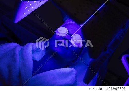 Relaxation during a skin treatment session at a wellness center 128907891