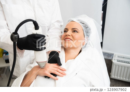 Beauty treatment session at a spa with a client in a relaxing setting Beauty treatment session at a spa with a client in a relaxing setting 128907902