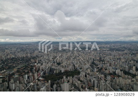 Vast urban landscape of Sao Paulo with cloudy sky and city skyline views Vast urban landscape of Sao Paulo with cloudy sky and city skyline views 128908029