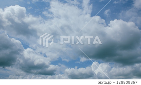 Vibrant Dynamic Cloudscapes Set Against Stunningly Bright Blue Skies Full of Life 128909867