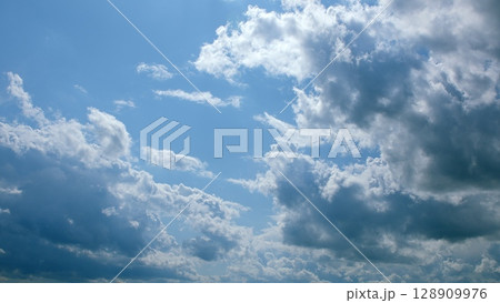 A Beautiful Cloudy Sky That Exists Under the Bright Rays of Sunlight This Afternoon A Beautiful Cloudy Sky That Exists Under the Bright Rays of Sunlight This Afternoon 128909976