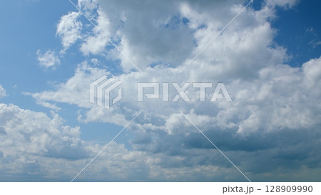 A Beautiful Cloudy Sky with a Soft Light Blue Background Radiating Calmness and Serenity 128909990