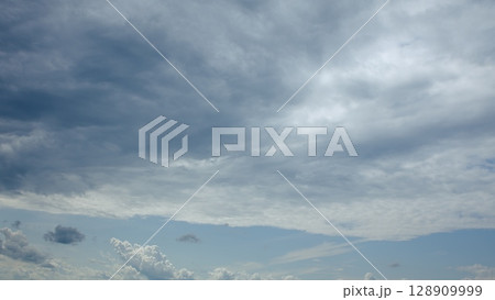 A Dramatic Cloudy Sky Displaying Rich Shades of Blue and Gray, An Incredible View A Dramatic Cloudy Sky Displaying Rich Shades of Blue and Gray, An Incredible View 128909999