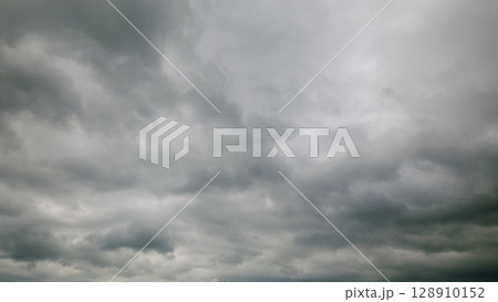 Dramatic Gray Clouds Overcast the Entire Sky, Creating a Unique Atmosphere and Mood 128910152
