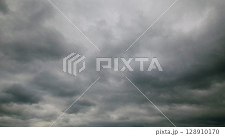 An Overcast Sky Filled with Dramatic Gray Clouds Creating a Unique and Moody Atmosphere 128910170