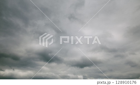 The sky is overcast, filled with dark and dramatic clouds, creating a moody atmosphere 128910176