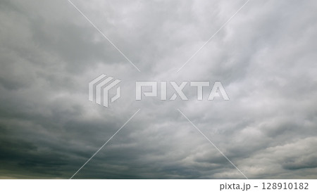 A Moody Overcast Sky Filled with Thick, Heavy Clouds Creating an Ominous Atmosphere 128910182