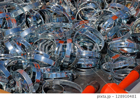 Metal hose clamps pile 128910481