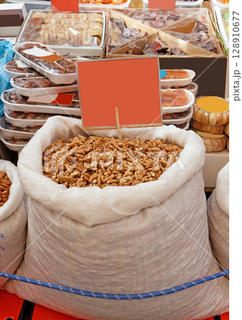 Bag of walnuts on market 128910677
