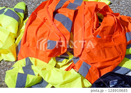 Pile of colorful uniforms sold on market Pile of colorful uniforms sold on market 128910685
