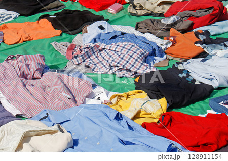 Colorful casual shirts on market outdoors 128911154