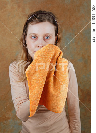 Woman cleaning cloth 128911588