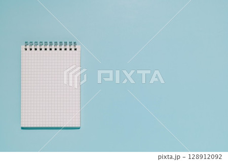 Blank Grid Notepad on Blue, Planning and Idea Space Blank Grid Notepad on Blue, Planning and Idea Space 128912092