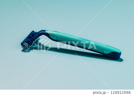 Blue and Green Razor on Blue, Shaving and Personal Care Blue and Green Razor on Blue, Shaving and Personal Care 128912098