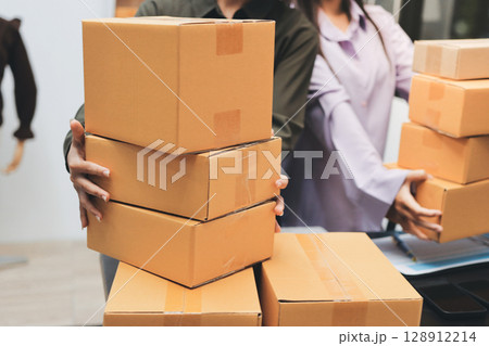 Portrait of Starting small businesses SME owners, two Asian woman check online orders Selling products working with boxs freelance work at home office, sme business online small medium enterprise 128912214