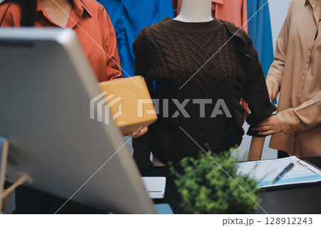 Portrait of Starting small businesses SME owners, two Asian woman check online orders Selling products working with boxs freelance work at home office, sme business online small medium enterprise 128912243