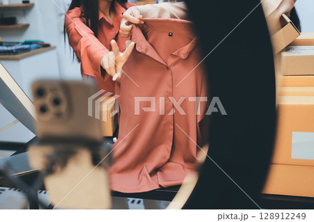 Portrait of Starting small businesses SME owners, two Asian woman check online orders Selling products working with boxs freelance work at home office, sme business online small medium enterprise Portrait of Starting small businesses SME owners, two Asian woman check online orders Selling products working with boxs freelance work at home office, sme business online small medium enterprise 128912249