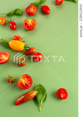 Healthy vegan ingredients tomatoes basil leaves for salad Healthy vegan ingredients tomatoes basil leaves for salad 128912643