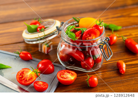 Organic garden tomatoes variety with seeds and pulp Organic garden tomatoes variety with seeds and pulp 128912648