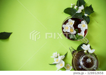 Green tea with jasmine in a glass teapot from above 128912658