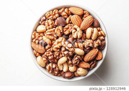 Healthy mix of almonds, walnuts and cashews in a white bowl. Healthy mix of almonds, walnuts and cashews in a white bowl. 128912946
