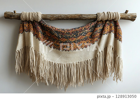 Fabric wall hanging on a white background. Boho-chic style. Fabric wall hanging on a white background. Boho-chic style. 128913050