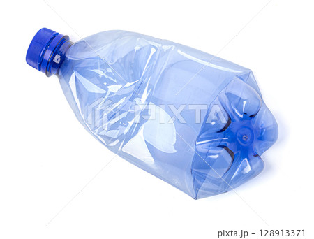 Used crushed blue plastic bottle with blue cap isolated on white background 128913371