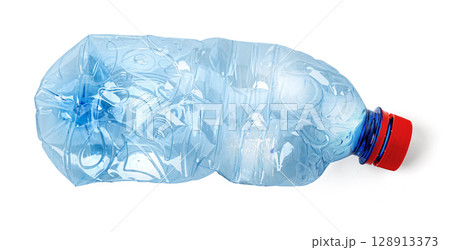Crushed plastic bottle symbolizing recycling and environmental conservation 128913373
